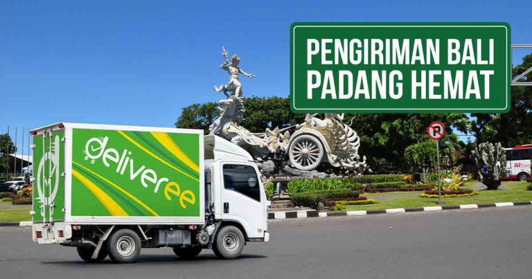 Truk Deliveree melewati jalan raya di belakangnya terdapat Patung Satria Gatotkaca di Bali, terdapat tulisan di kanan atas “Pengiriman Bali Padang Hemat”.